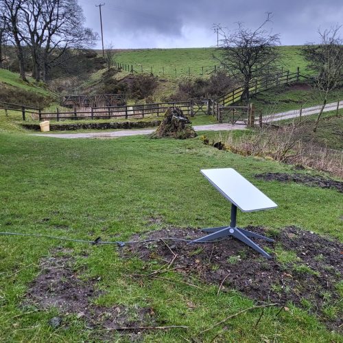 starlink dish on a field in the uk