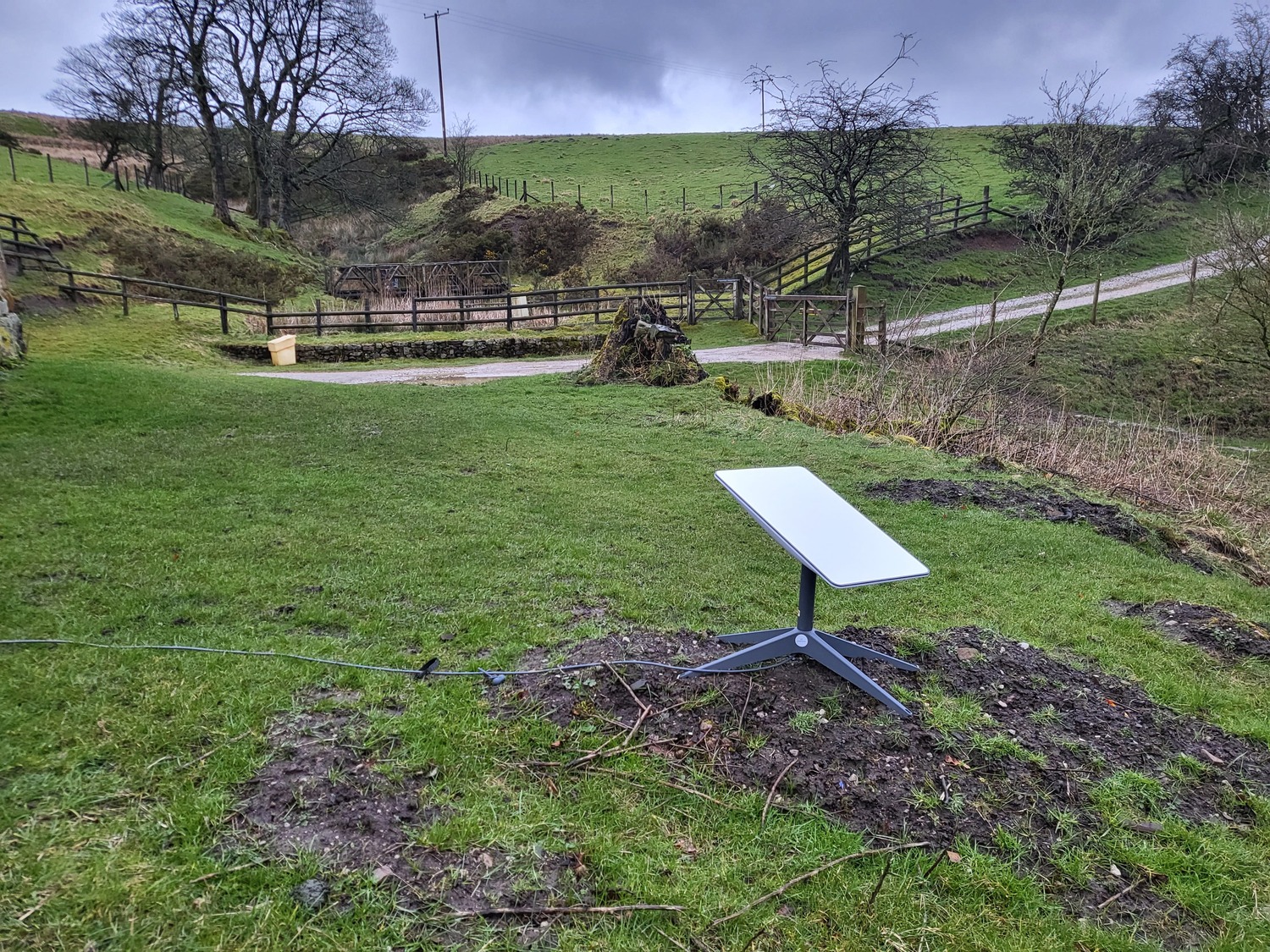starlink dish on a field in the uk